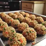 Crispy quinoa veggie balls on baking tray for healthy pet treats.