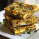 Delicious layered vegetarian lasagna bars filled with vegetables, cheese, and herbs, perfect for healthy snacks or appetizers. Made with fresh ingredients and rich flavors.
