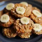 Soft banana and oatmeal dog treats topped with sliced bananas, perfect for healthy homemade pet snacks. Made with natural ingredients to keep your dog happy and healthy.