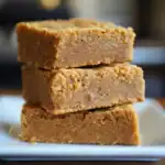 Creamy peanut butter energy bites stacked on plate, healthy snacks, no bake, protein-rich dog treats, homemade pet treats, nutritious dog biscuits, Waggy Chef.
