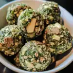 Creamy spinach and potato spinach balls with chopped nuts, fresh herbs, and spices, perfect for healthy snacks or appetizers. Delicious vegetarian bites with a nutty crunch.
