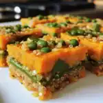 Quinoa and vegetable casserole with peas and carrots, healthy vegan meal, colorful nutritious dish, gluten-free vegan casserole, Waggy Chef healthy recipe.