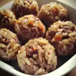 Savory beef and rice meatballs, glazed with sauce, close-up of homemade dog treats, healthy pet food snacks, Waggy Chef pet treat recipe, dog meal inspiration, healthy dog food option, pet nutrition, gourmet dog treats, high-quality pet treats.