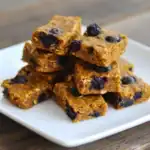Delicious homemade blueberry oatmeal bars with fresh blueberries and oats, perfect for a healthy snack or breakfast on-the-go. Nutritious, easy to make, and irresistibly tasty.