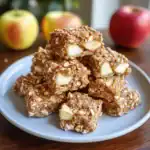 Delicious homemade apple and nut granola bars with oats and caramel, perfect for healthy snacks or breakfast. Made with fresh ingredients and great for pet-friendly treats.