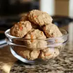 Savory homemade dog meatballs in a glass bowl on a kitchen countertop, perfect for pet nutrition and homemade dog treats.