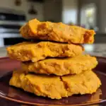 Golden sweet potato fall cookies stacked on a plate, showcasing homemade, allergy-friendly fall treats perfect for kids and families.