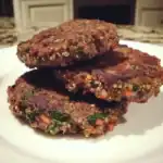 Savory quinoa and veggie veggie patties, crispy and cooked to perfection, made with fresh ingredients and herbs for healthy, flavorful vegan snack or meal option.