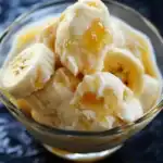 Creamy banana ice cream with honey drizzle, perfect for delicious and healthy desserts, homemade ice cream recipes, and fruit-based frozen treats.