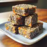 Crunchy quinoa bars coated with chia seeds and dried sweet potatoes, healthy vegan snack, nutritious and delicious.