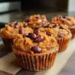 Sweet potato and black bean muffins topped with baked beans, made by Waggy Chef, showcasing healthy and tasty pet treats. Perfect for dogs who enjoy nutritious, homemade snacks.