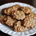 Oatmeal peanut butter cookies served on a white plate, showcasing a crispy and chewy texture perfect for healthy snack options.