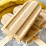 Creamy banana flavored popsicles made with fresh bananas and natural ingredients, perfect for a healthy snack or sweet treat. Ideal for summer desserts and homemade frozen treats.