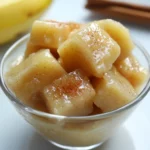 Sweet potato cubes in a glass bowl, seasoned with cinnamon, highlighting healthy, homemade pet treats from Waggy Chef.