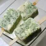 Refreshing homemade cilantro and lime popsicles perfect for pet-friendly treats and summer relaxation. Made with natural ingredients, ideal for dogs and humans alike.