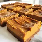 Rich caramel brownie bars with a crispy chocolate crust and gooey caramel filling, perfect for dessert or sweet snacks. Made with quality ingredients for a delicious treat.