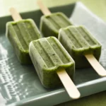 Refreshing spinach banana smoothies on a white plate, served as healthy frozen treats, perfect for cooling down and nutritious snacking.