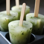 Refreshing homemade green cilantro and lime popsicles, perfect for summer treats and healthy snacks, made with fresh ingredients for a deliciously cool dessert.