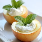Sweet apple bowls filled with creamy yogurt, topped with fresh mint leaves, perfect for healthy snacks or breakfast.