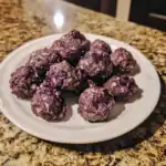 Chewy homemade berry energy bites made with oats, nuts, and dried berries on a white plate. Healthy snack option, perfect for quick energy, and diet-friendly treats at Waggy Chef.