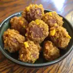 Crispy-coated beef or veggie bites on black plate, with crunchy texture and golden exterior, served as delicious snack, appetizer, or party finger food for meat lovers and food enthusiasts.