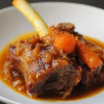 Slow-cooked beef short ribs with vegetables in rich gravy, perfect for gourmet pet meals.